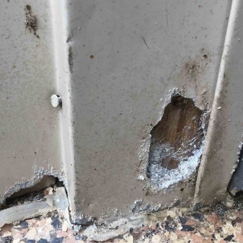 Damaged aluminum door trim